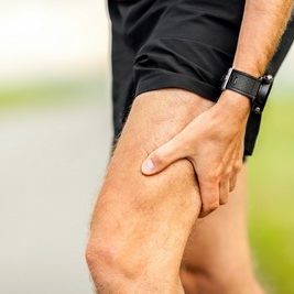 Runners leg and muscle pain on running training outdoors in summer nature, sport jogging physical injury when working out. Health and fitness concept with sore body